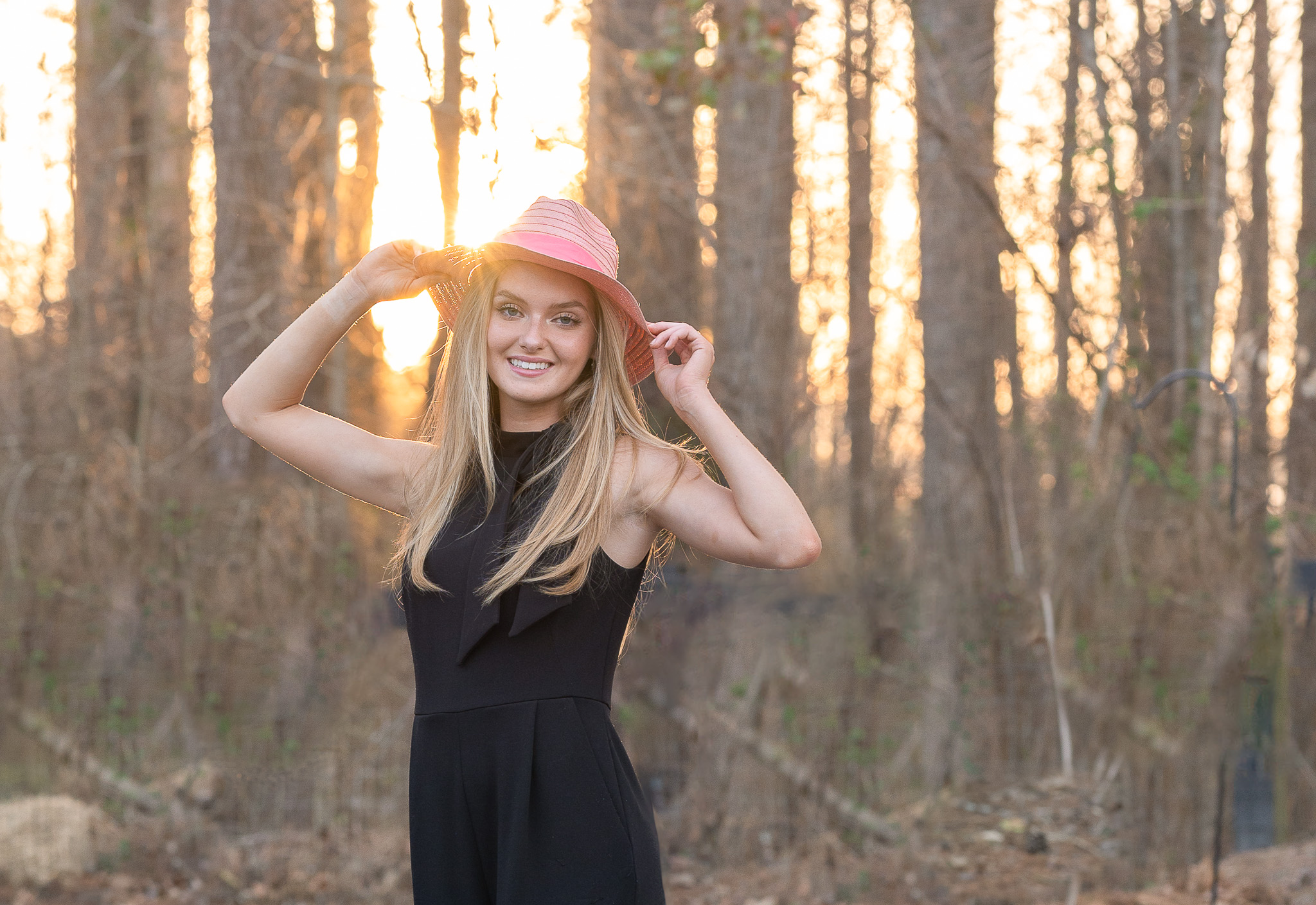 Marietta high school senior girl wearing a barbie pink hat for senior pictures by eliza klusmann photo